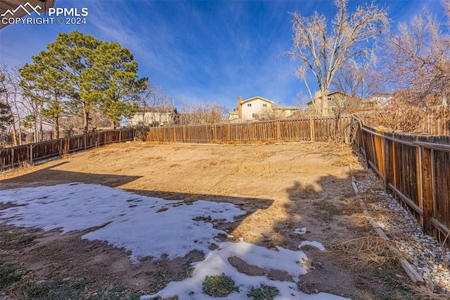 view of yard layered in snow