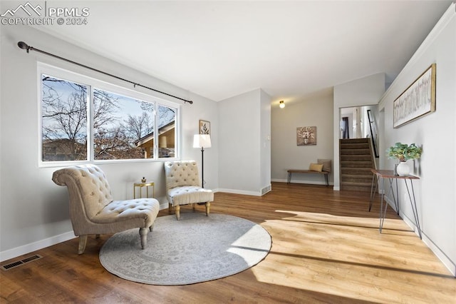 sitting room featuring hardwood / wood-style floors