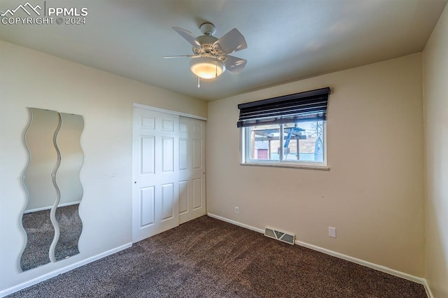 unfurnished bedroom featuring a closet, ceiling fan, and carpet flooring