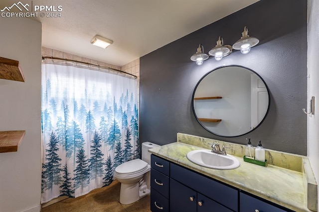 bathroom featuring vanity, tile patterned floors, and toilet