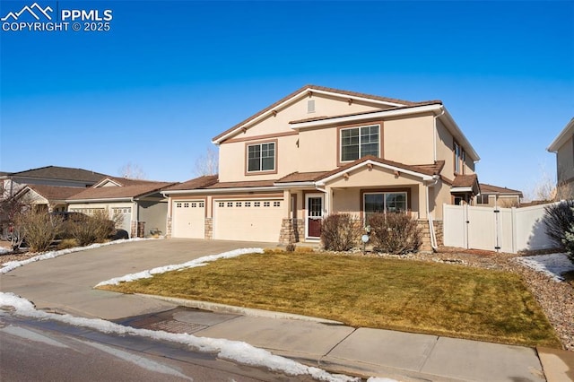 front of property featuring a garage and a front yard