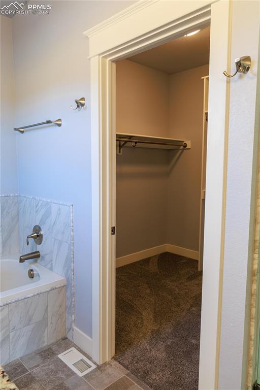 bathroom with tiled bath