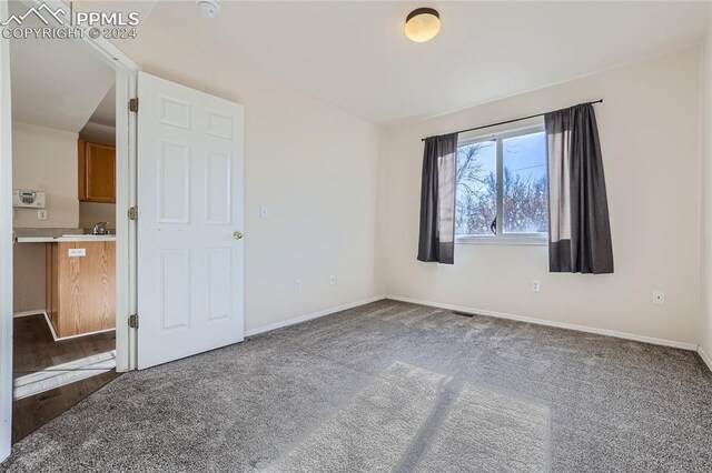 empty room with carpet flooring