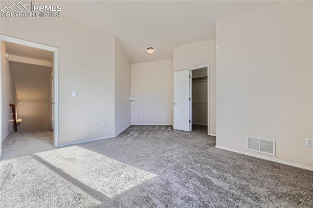 unfurnished bedroom with a closet and carpet