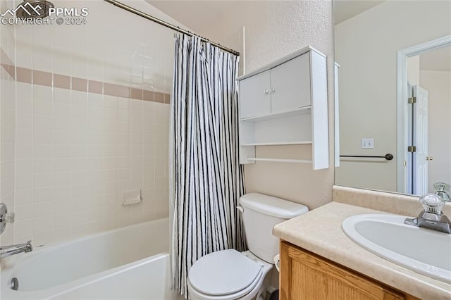 full bathroom with vanity, toilet, and shower / bath combo with shower curtain