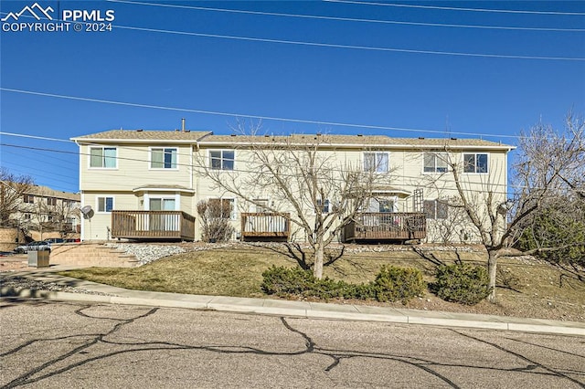 view of front of property with a wooden deck