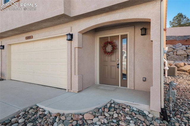 doorway to property featuring a garage