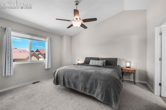 carpeted bedroom featuring ceiling fan and vaulted ceiling