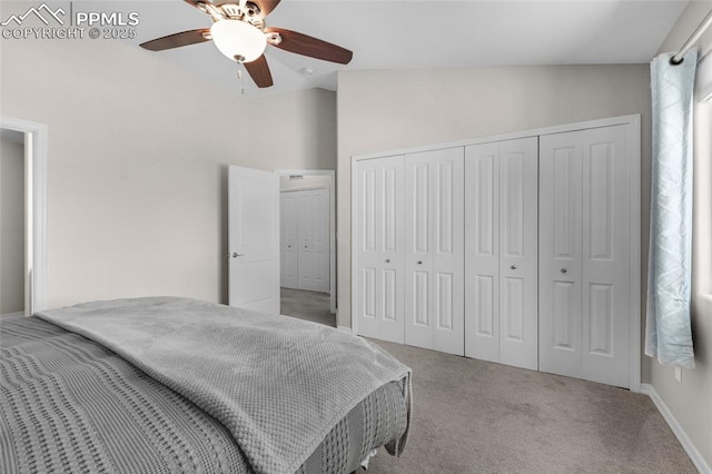 carpeted bedroom featuring ceiling fan and vaulted ceiling