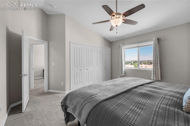 bedroom with carpet flooring, a closet, ceiling fan, and lofted ceiling