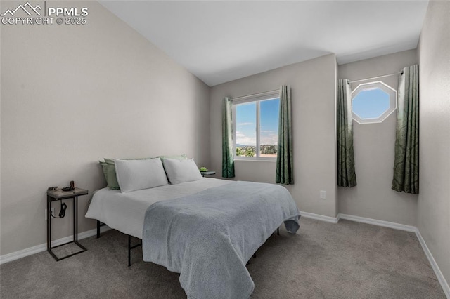 bedroom with light colored carpet and lofted ceiling