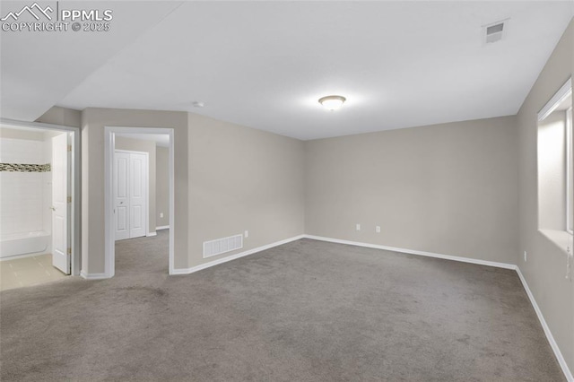 empty room featuring light colored carpet