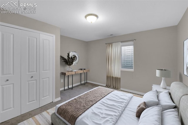 carpeted bedroom with a closet