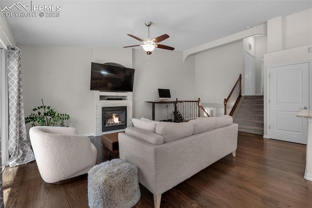 living room with ceiling fan and dark hardwood / wood-style floors