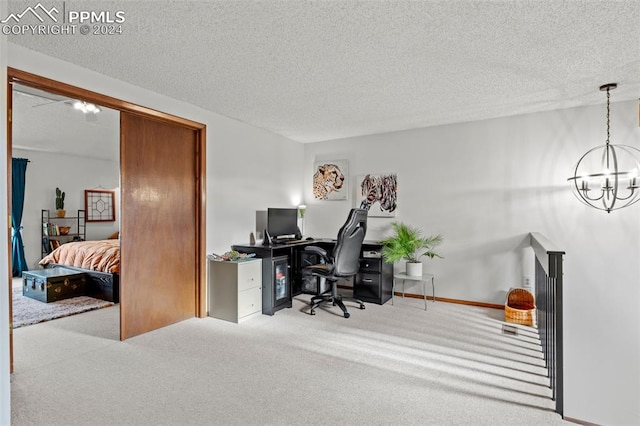 office space with light colored carpet, a textured ceiling, and a chandelier