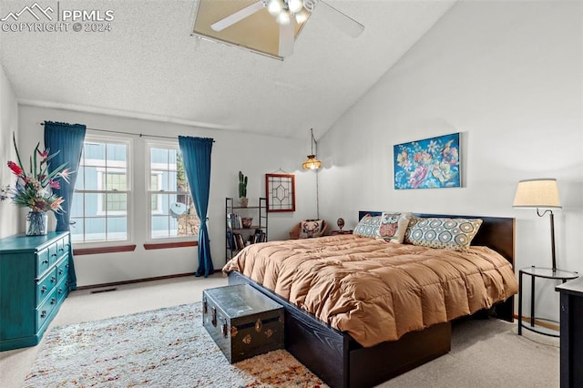 carpeted bedroom with ceiling fan and vaulted ceiling