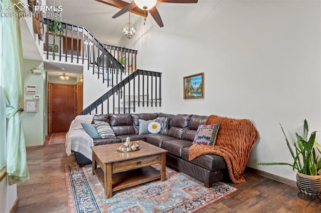 living room featuring ceiling fan, high vaulted ceiling, and wood-type flooring