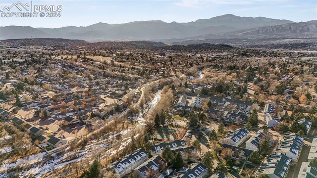 birds eye view of property with a mountain view