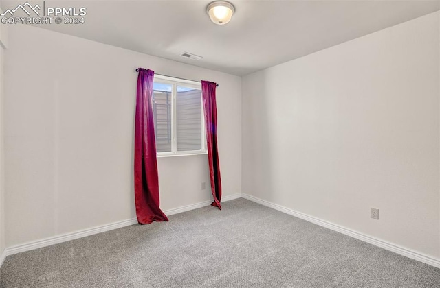 empty room featuring carpet flooring