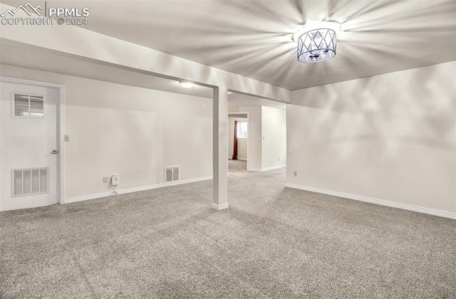 basement featuring carpet flooring