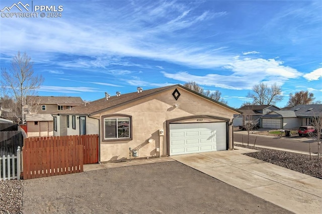 view of front of property featuring a garage