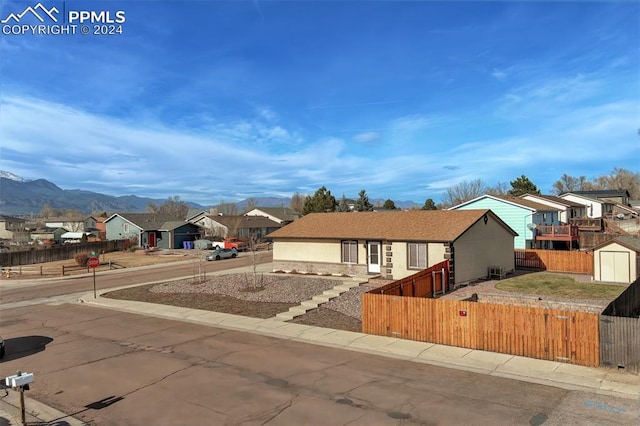 view of front of home featuring a mountain view