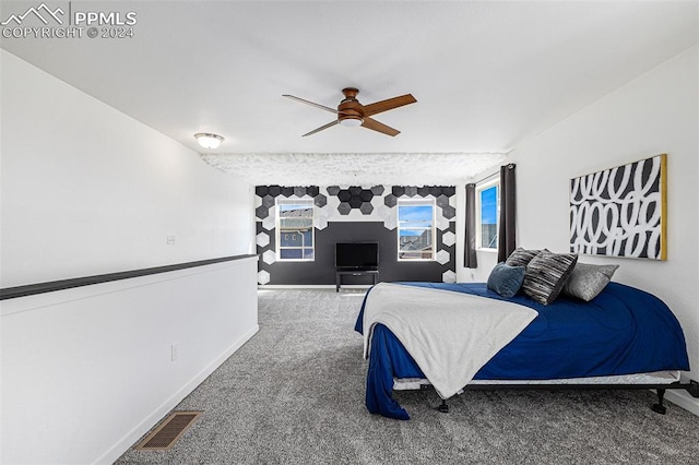 carpeted bedroom with ceiling fan