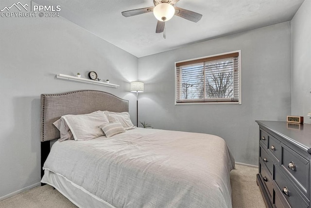 bedroom with ceiling fan and light colored carpet