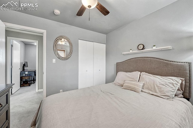 carpeted bedroom featuring ceiling fan and a closet