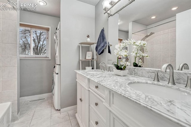 bathroom featuring vanity and tiled shower / bath combo