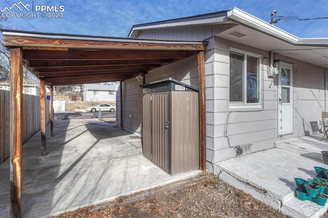 view of side of home with a carport