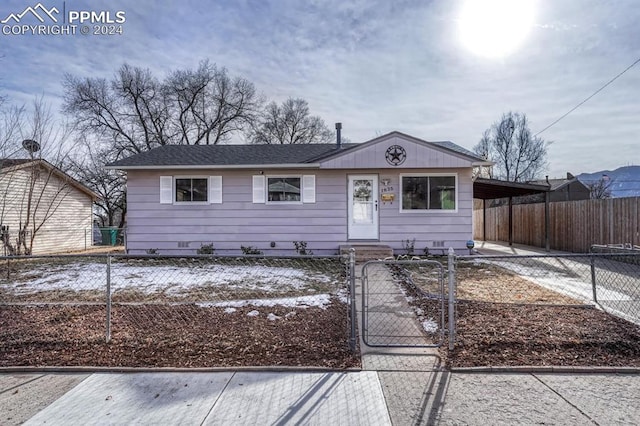 ranch-style home with a carport