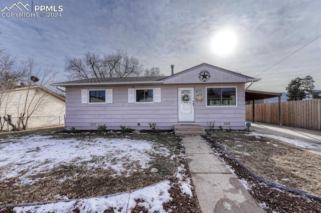 single story home with a carport