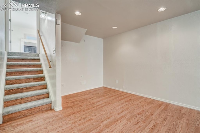 basement featuring wood-type flooring