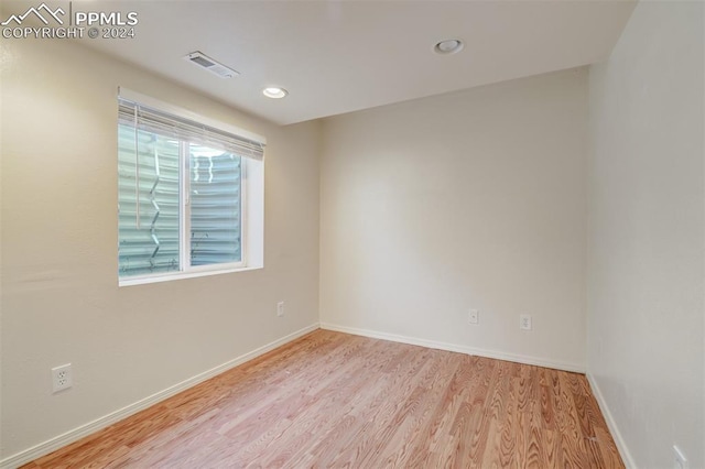 spare room featuring light wood-type flooring