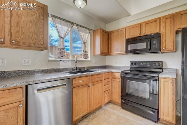 kitchen featuring black appliances and sink