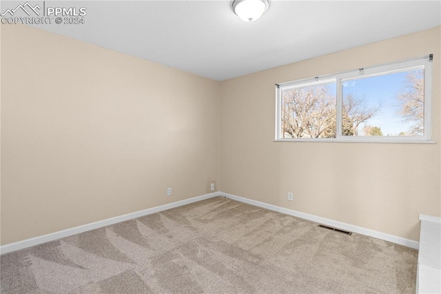 view of carpeted spare room