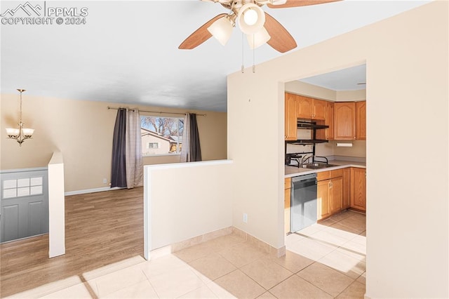 kitchen featuring stainless steel dishwasher, ceiling fan with notable chandelier, sink, light tile patterned floors, and hanging light fixtures