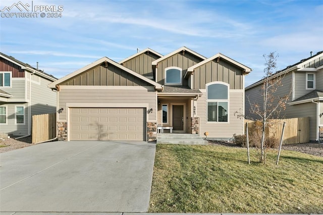 view of front of home with a garage and a front yard