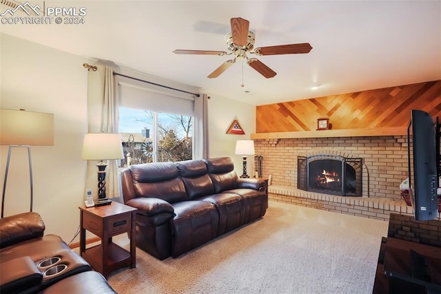 living area featuring a brick fireplace and ceiling fan