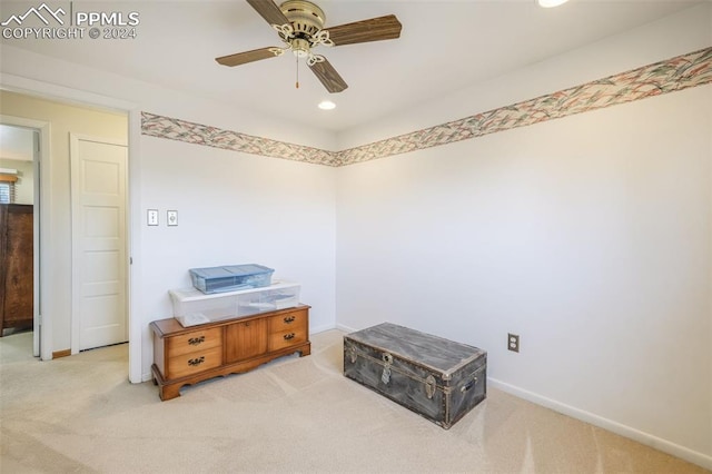 interior space featuring light carpet, baseboards, a ceiling fan, and recessed lighting