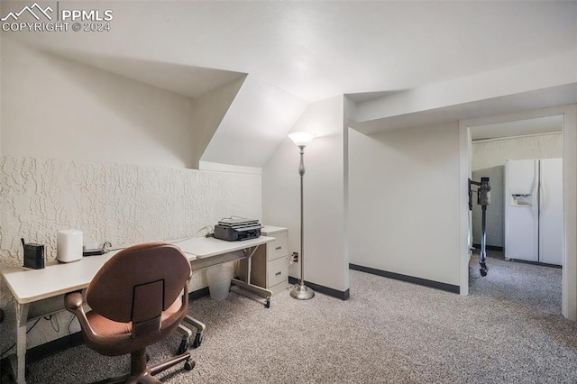 home office featuring light carpet and baseboards