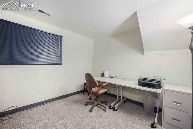 office area featuring carpet flooring, visible vents, and baseboards