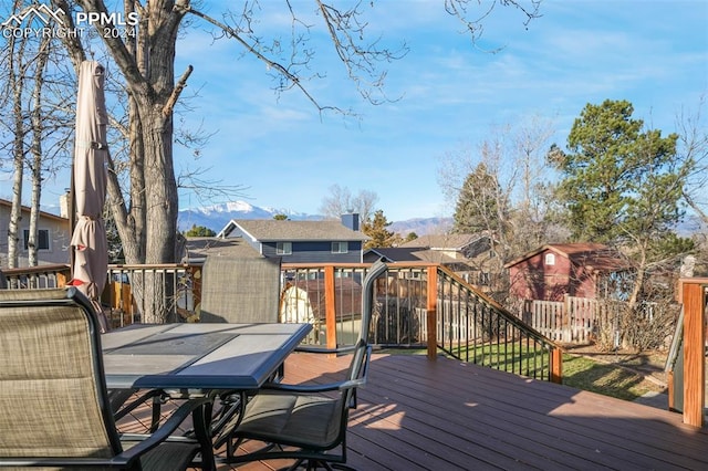 wooden deck featuring fence and outdoor dining area