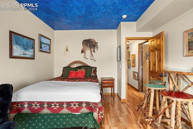 bedroom featuring wood-type flooring