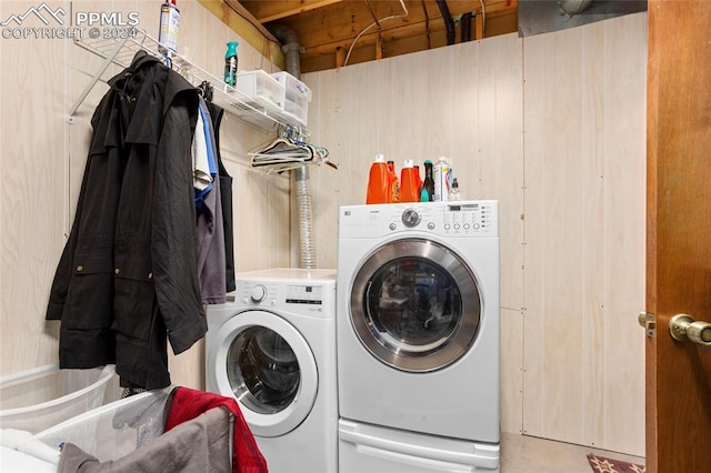 washroom with washing machine and clothes dryer