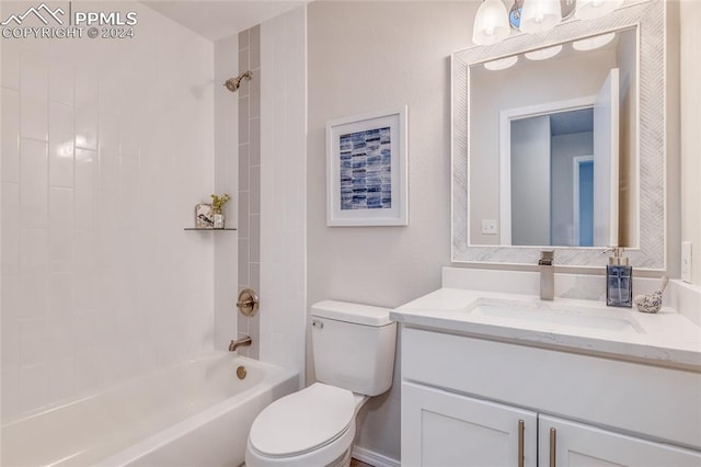 full bathroom with vanity, tiled shower / bath, and toilet