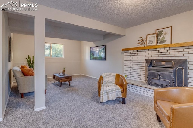 living room with light carpet, a textured ceiling, and a wood stove