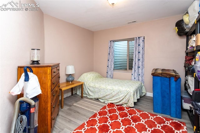 bedroom featuring hardwood / wood-style floors