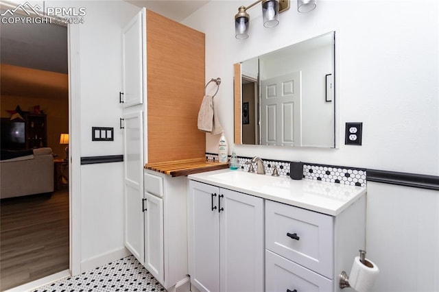 bathroom with tile patterned floors and vanity